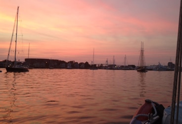 Newport, RI sunset As lovely as the evening view is from Lyra's Newport mooring, we're ready for a change of scenery. At least for a little while!