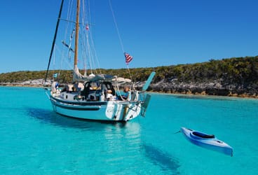 Small boat, big adventures: Calypso and her crew of four are right at home at Ship Channel Cay, Bahamas.