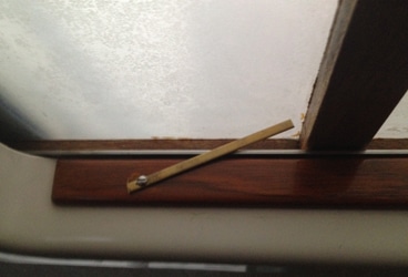 Reader Tip: hatch lock When in place, the bronze bar wedges against the wood cross beam of the Lexan sliding hatch and is a simple way to lock the companionway from the inside.