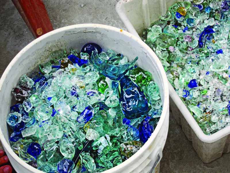 Glass waste is prepared for processing into trophies and paperweights at the Green VI studio in Cane Garden Bay, Tortola, British Virgin Islands.