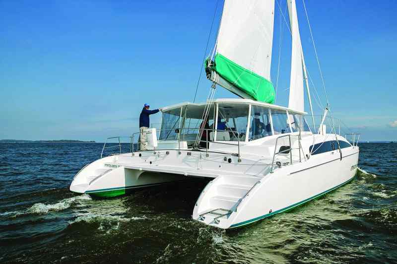 The Maine Cat 41 was the second cat designed by company founder Dick Vermuelen. Like its smaller sibling, the centerpiece of the cat is a centralized helm with a hard top overhead but surrounded by soft sides, specifically roll-down windows that transform the bridgedeck from an open patio and living area to an enclosed, protected “great room” that keeps out the elements.