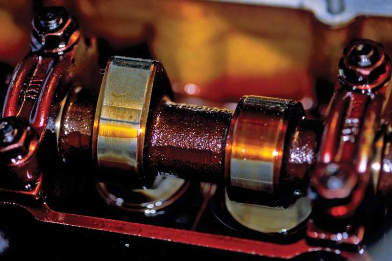 Oil failure causes sludge and tarnish, which impedes flow to bearings, but oil type is not a major factor here.