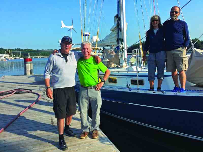 Just before leaving the fuel dock after topping off for the final time, we persuade a tourist to take a crew shot.