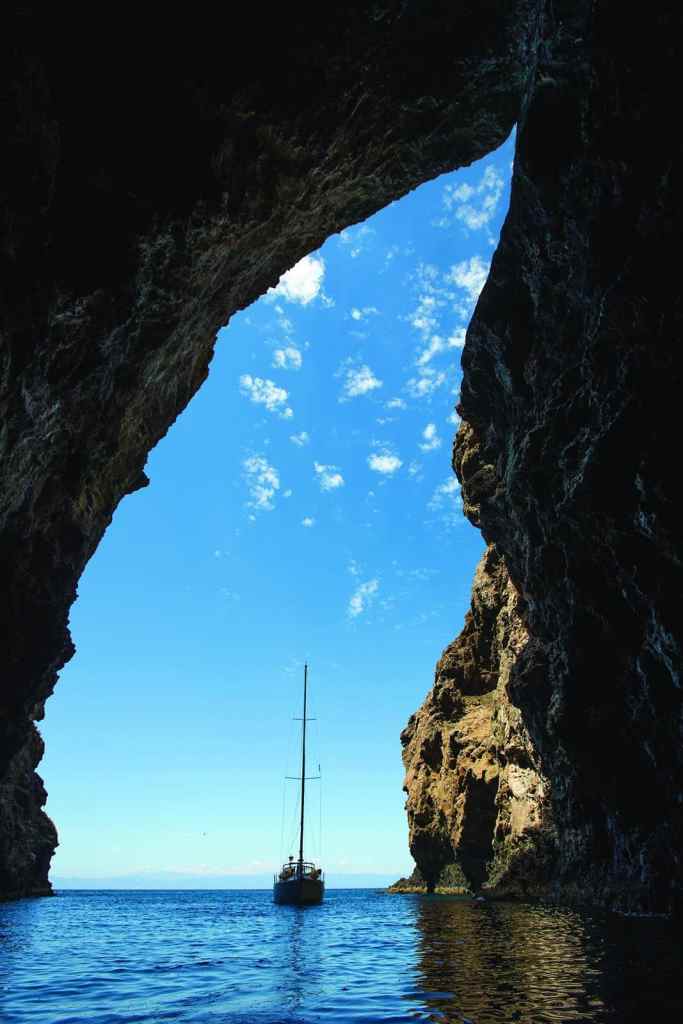 Jenny Lane, a Catalina 50 chartered from Santa Barbara Sailing Center, awaits the return of adventurers exploring Painted Cave by dinghy.