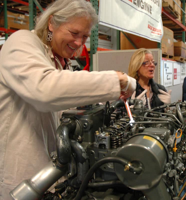 Lauralyn loosens the fuel injector lines so the engine won't inadvertently start.