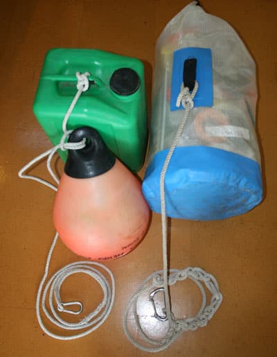 Alvah Simon suggests using carabiners to attach the jerry jug, marker float, and ditch kit to the life raft.