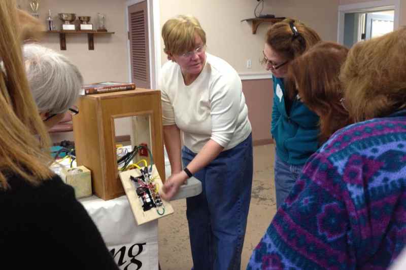 Women’s Electrical Workshop Beth Burlingame explains the working components of the 12-volt electrical display panel.