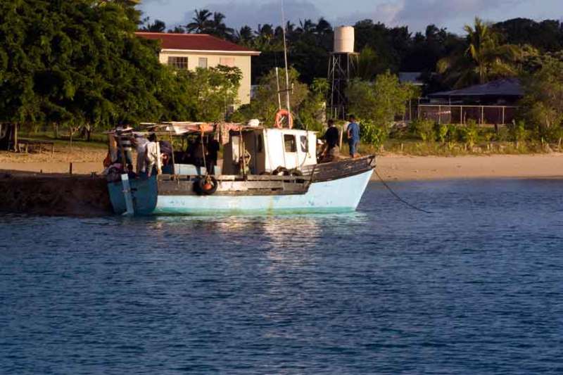 Fishing Boat In Vava'u, fishing boats are also the freighters and the water taxis. On Fridays, islanders come home from the "mainland," Neiafu, as do the older children, who spend the week in town going to school.