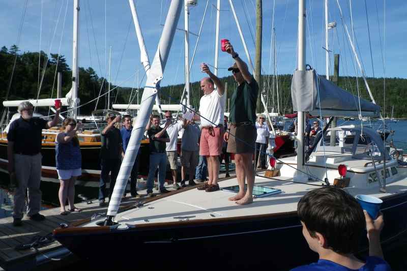 m-imgp3205.jpg Their speeches complete, Doug Metchick urged everyone to grab a beverage, pour a dollop to Poseidon and then raised a toast for the M Series. The only thing more anyone could have asked for was to go for a sail.