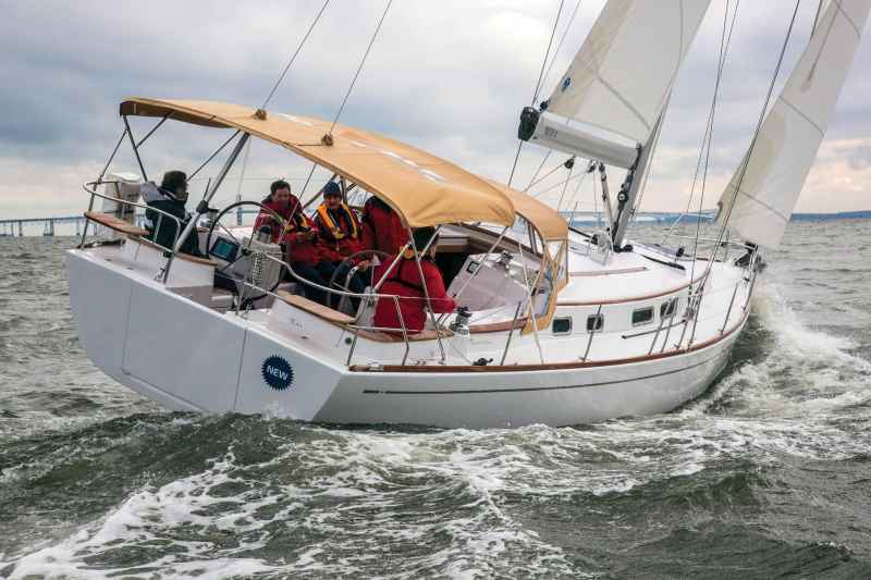 Moody Aft Cockpit 41 Contributing to the secure feeling of the Moody Aft Cockpit 41 under sail are the wide, uncluttered side decks and the coamings that wrap around the back of the cockpit, behind the twin wheels.