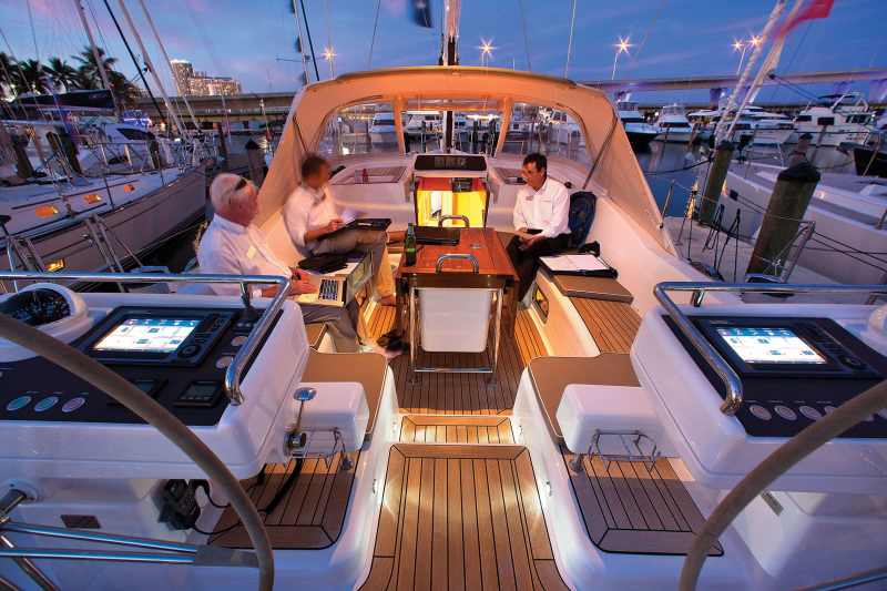 The expanded cockpit on this Oyster 625 is just about perfect, and includes a generous dodger over the companionway, a central table, loads of seating and open walk-throughs.