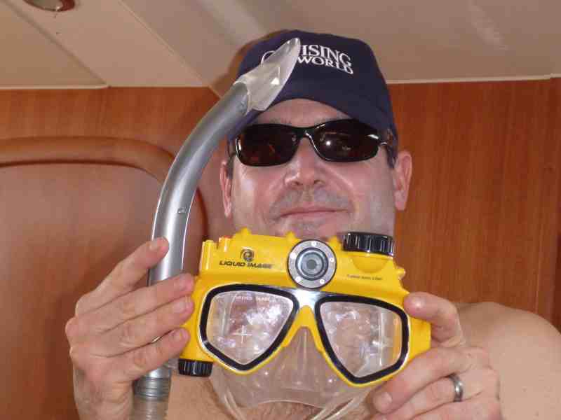 Crewmate Pat Manion models the Liquid Image, a mask and digital camera.