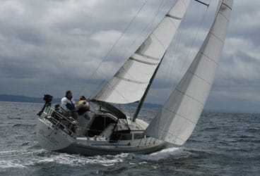 This aft-cockpit version of the 30-foot S2 9.2 is a weatherly racer/cruiser with decent accommodations, and it really shines under sail.