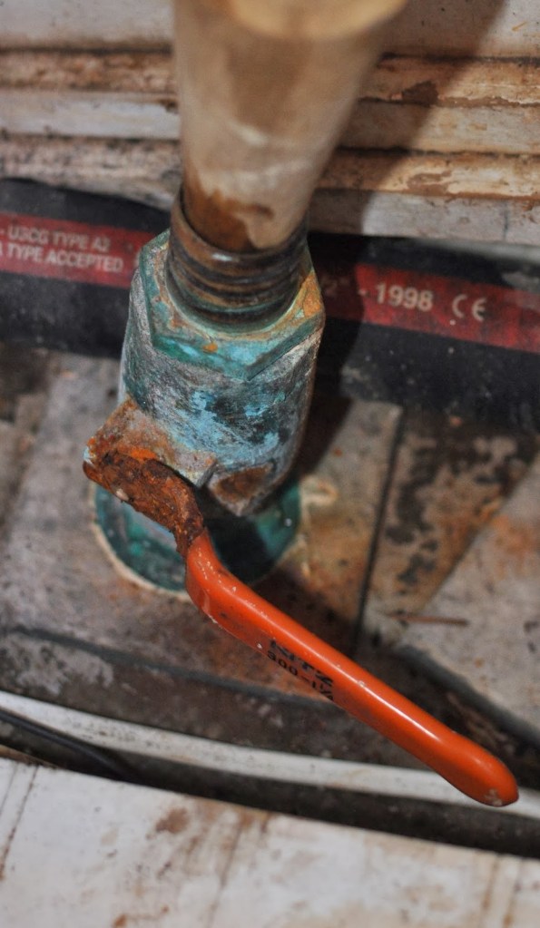 Throuh Hull Valve For a long time I've meant to replace the handle of this galley sink drain thru-hull valve. I finally got to it, only to have the bolt shear off when I tried to loosen it. Now I'm going to replace the entire valve--at anchor.