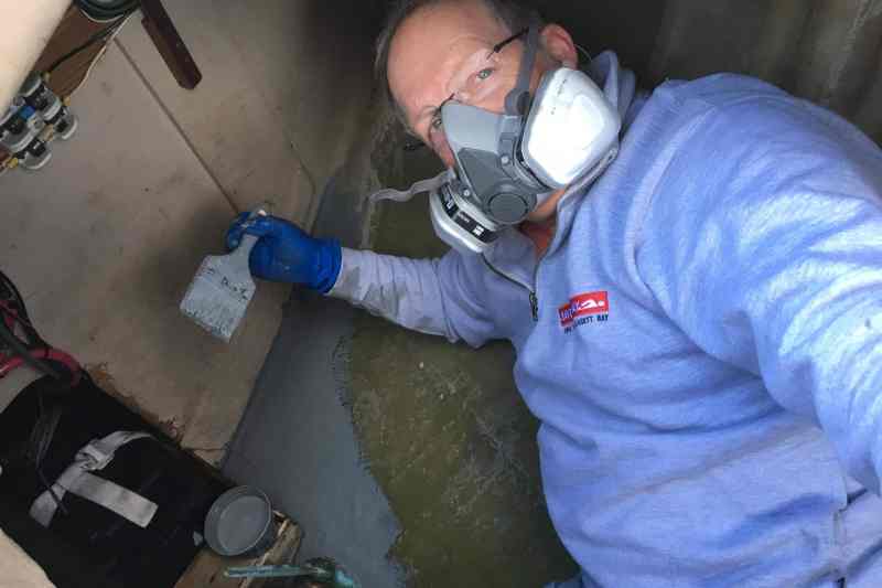 Onne van der Wal works on his sailboat.