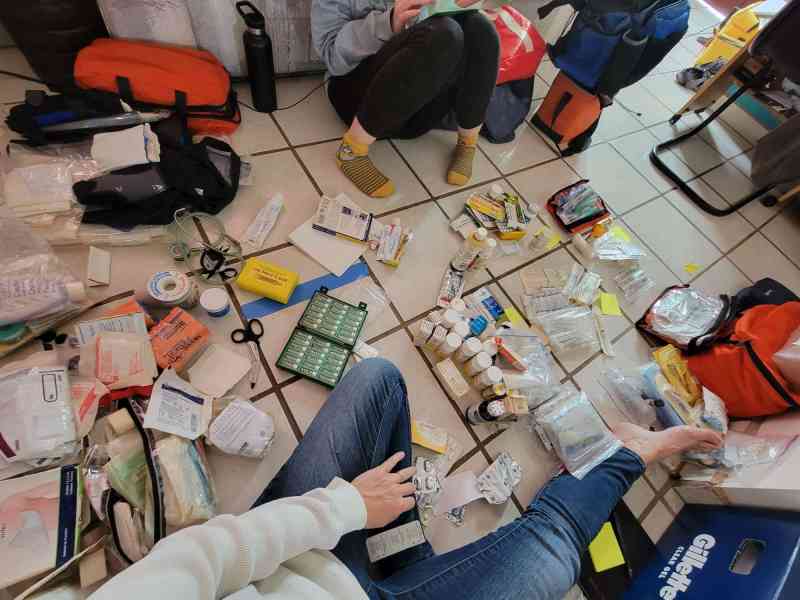 1 sorting through med kit medical kit