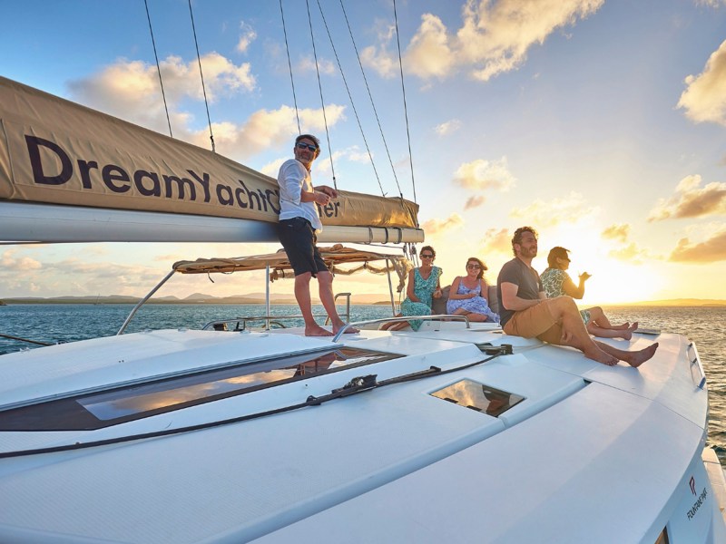 Cruising World images – CW Header Image_1600x900 Passengers on a catamaran enjoying a sunset