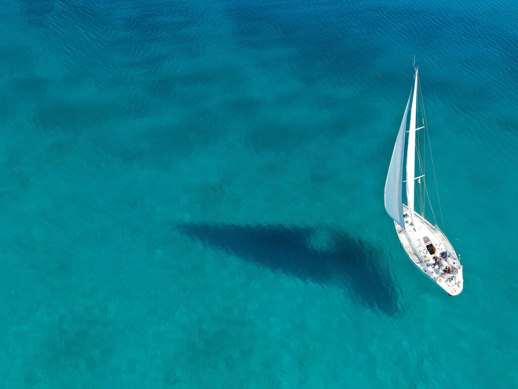 Aerial drone ultra wide photo of beautiful sail boat sailing in