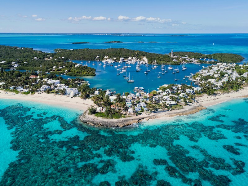 Hope Town, Beach and Lighthouse, Abaco Aerial view of the harbour, beach and lighthouse in Hope Town on Elbow Cay off the island of Abaco, Bahamas.