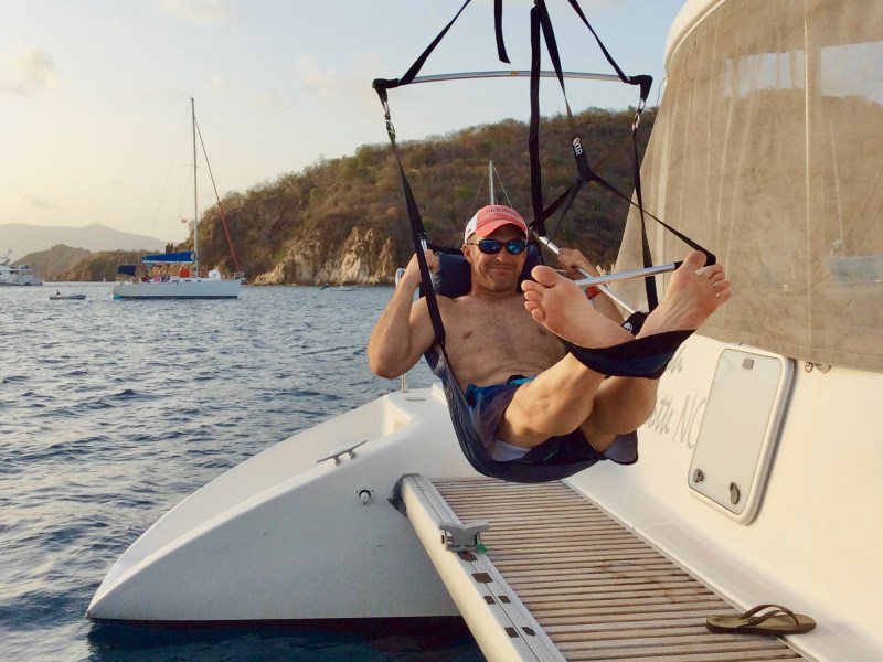 Mike Crosby in a hammock on his boat
