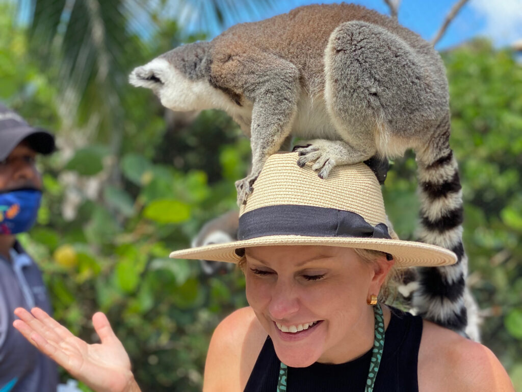 Cindy Crosby with a lemur on her head