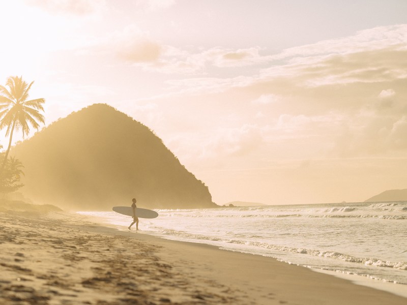Man with surfboard in Tortola