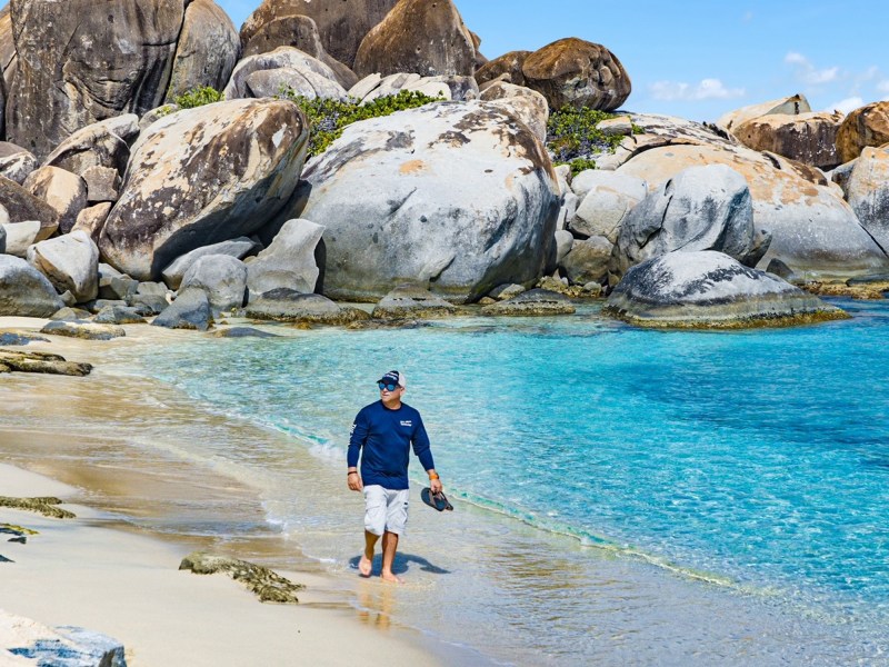 Man walking on the beach in the BVIs