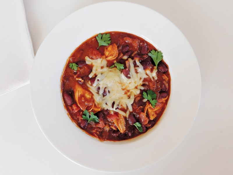 Chicken-Chili-3 Bowl of chicken chili on a white table