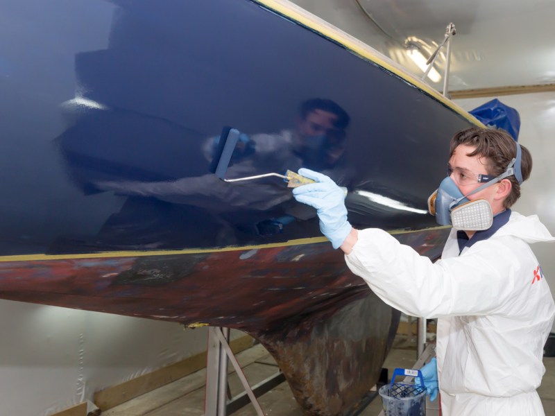 Restoration-image-1-(2) Painting a boat