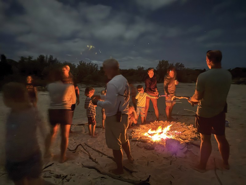 afterdark2 People around a bonfire on the beach