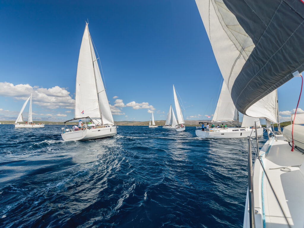 Sailing regatta yachts competition. Summer sport and recreation activities.