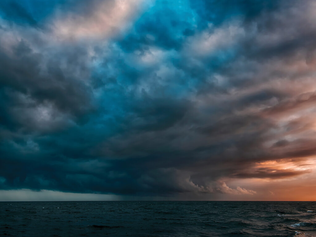 Dark clouds gather on the horizon
