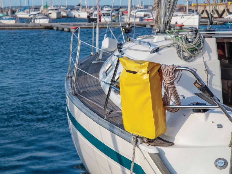 Rescue Sling on a sailboat, yacht in the marine. Boat launch checklist, yellow sling, safety, MOB, over board Rescue Sling on a sailboat, yacht in the marine. Boat launch checklist, yellow sling, safety, MOB, over board