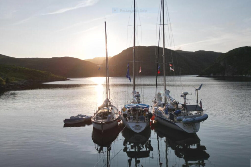 three boats enjoying the calm waters together