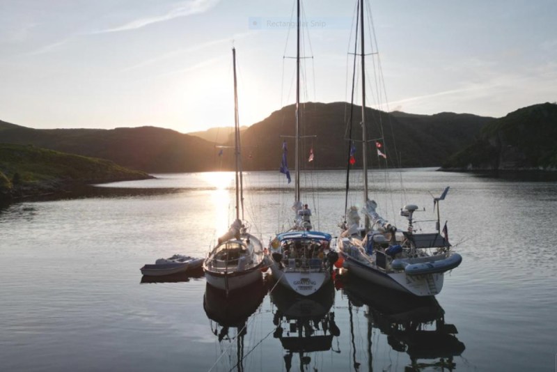 three boats enjoying the calm waters together