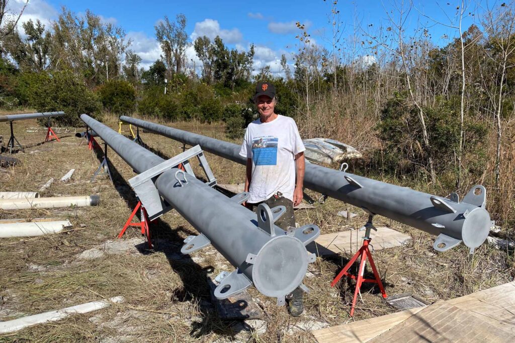 steel masts lay on the ground