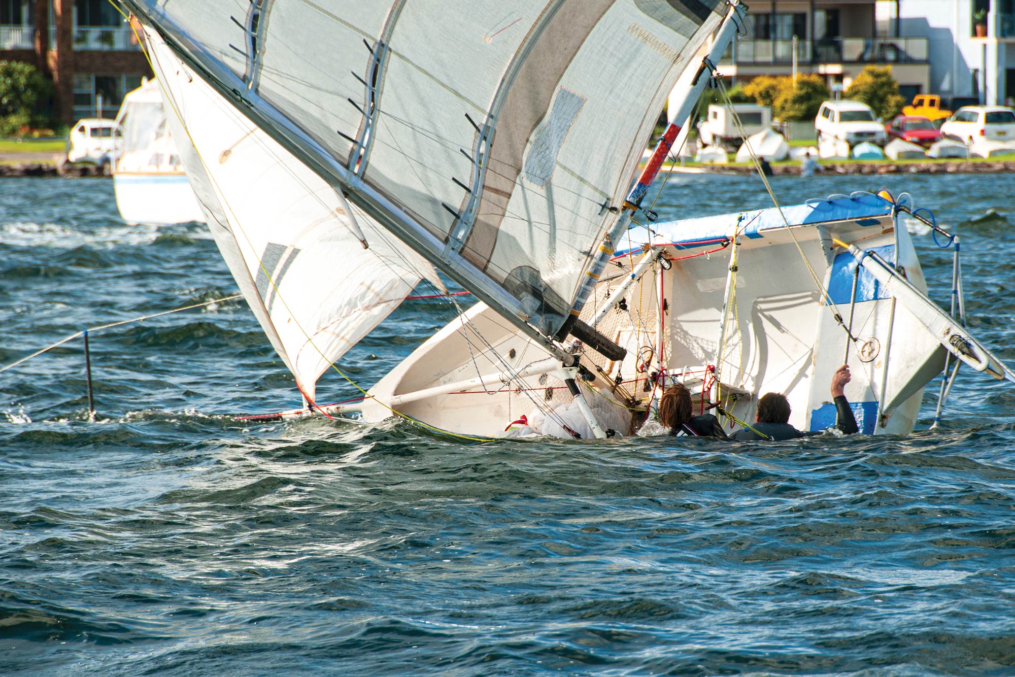 Small capsizing sailboat