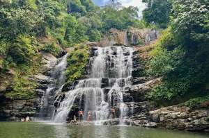 Tourists gather at Nauyaca Waterfall