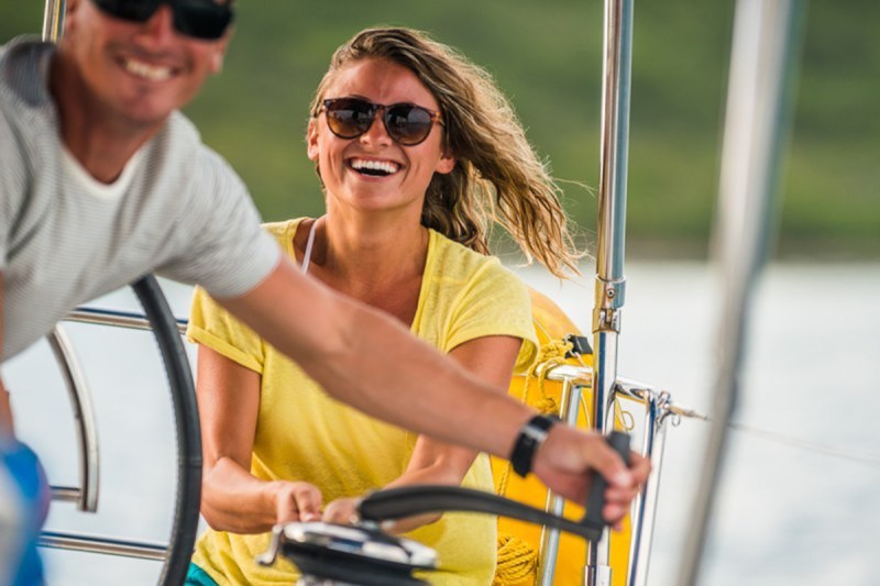 A couple on a chartered Sunsail sailboat.