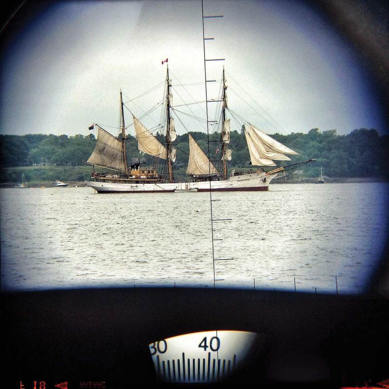 Taking a bearing on a distant ship through binoculars